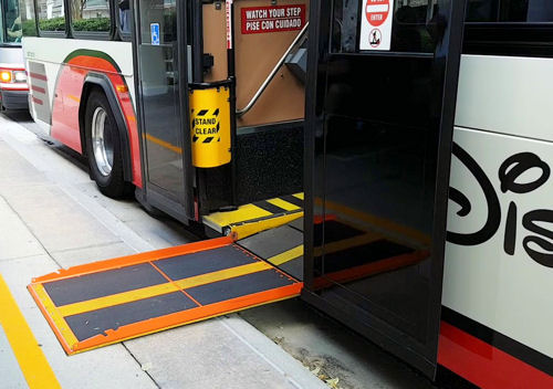 Handicap accessible ramp at rear door of Disney bus