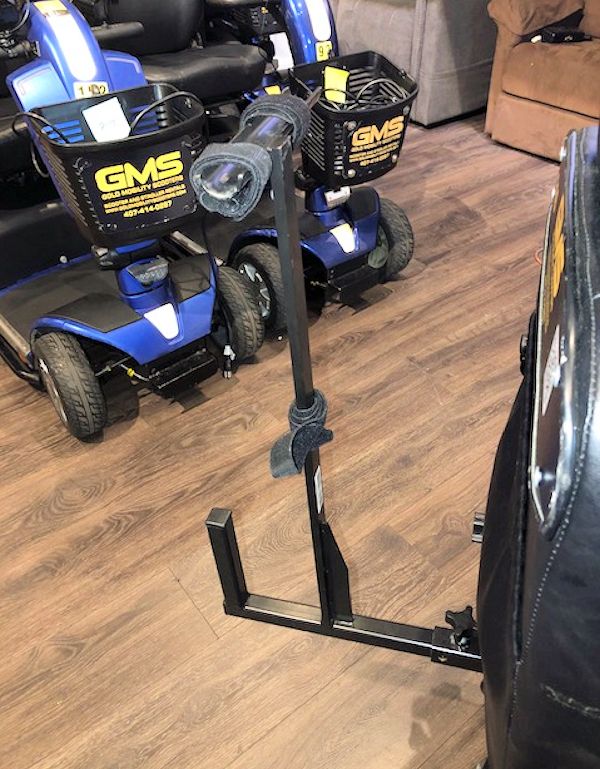 Image Of A Pride Mobility Walker Holder Mounted On A Pride Victory 10 Mobility Scooter