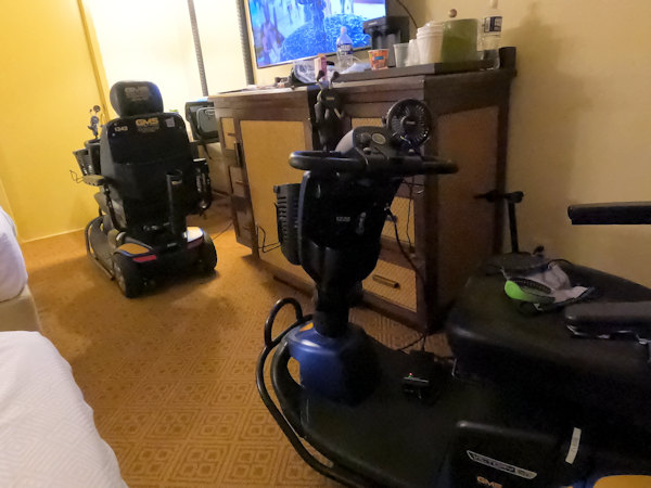 This image shows two mobility scooter in a room at the Caribbean Beach Resort from another angle.