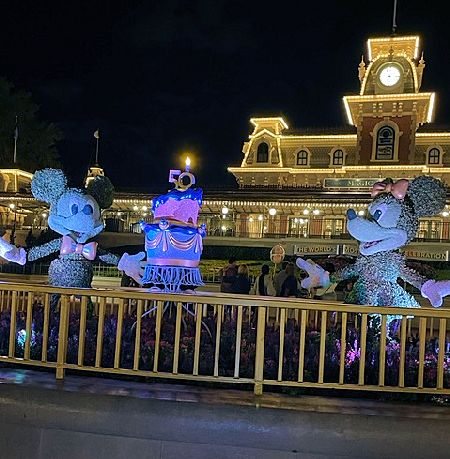 Finding the Mickey and Minnie Topiaries with 50th Anniversary cake during my scavenger hunt.